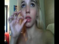 Lovely little blonde receives a cumshot right on her innocent face